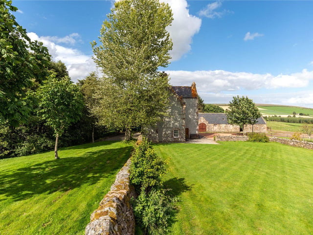 The south facing garden has a traditional stone dyke wall.
