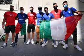Turkey and Italy fans pose together in Rome. Photo: ALBERTO PIZZOLI/AFP via Getty Images