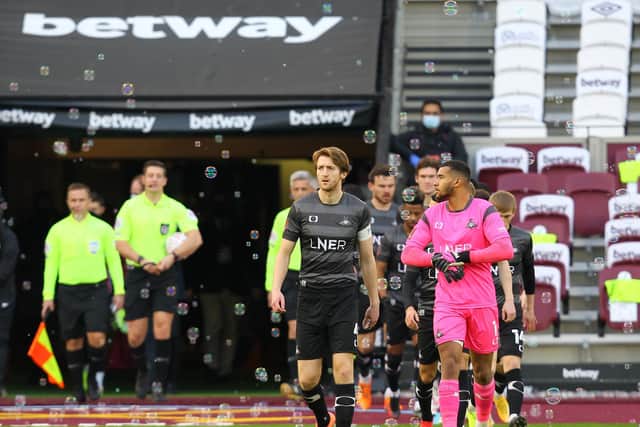Tom Anderson leads Rovers out at the London Stadium. Picture: Gareth Williams/AHPIX