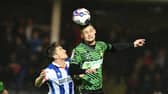 Doncaster's Luke Molyneux wins an aerial challenge.