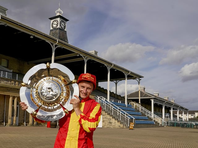 Tom Marquand celebrates with the trophy and cap after riding Galileo Chrome victory in 2020, a race that was held behind closed doors due to the Covid pandemic. (Photo by Alan Crowhurst/Getty Images)