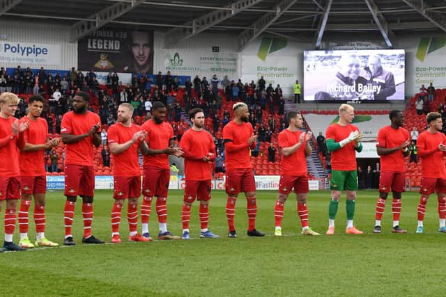 Doncaster Rovers' players pay their respects to Richard Bailey. Picture: Andrew Roe/AHPIX LTD