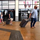 Passengers wearing a face mask or covering due to the COVID-19 pandemic (Photo by Anthony Devlin / AFP) (Photo by ANTHONY DEVLIN/AFP via Getty Images)
