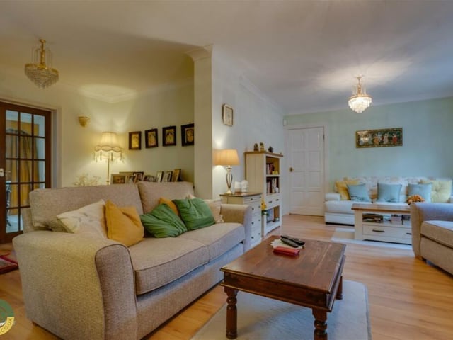 This room is currently a family room within the property.