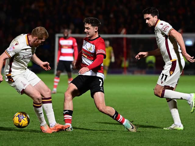 Luke Molyneux gets past Bradford's Brad Halliday Picture: Andrew Roe/AHPIX LTD