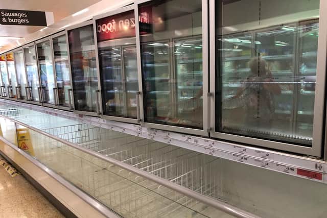 File photo dated 22/07/21 of empty shelves in the sausage and burger section of the freezer aisle at the Sainsbury supermarket.  Photo credit: Tom Wilkinson/PA Wire