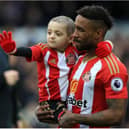 Footballer Jermain Defoe with Bradley Lowery.