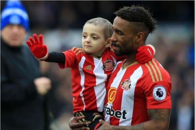 Footballer Jermain Defoe with Bradley Lowery.