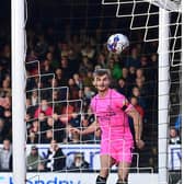 George Miller opens the scoring against Grimsby Town.