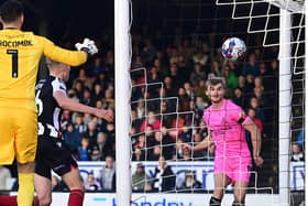 George Miller opens the scoring against Grimsby Town.