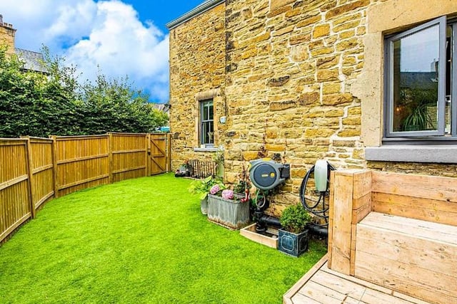 And here's the back garden itself, with a lawn and room for plants and seating. For even greater access to the outdoors, the boundary of the Peak District is only four miles away.