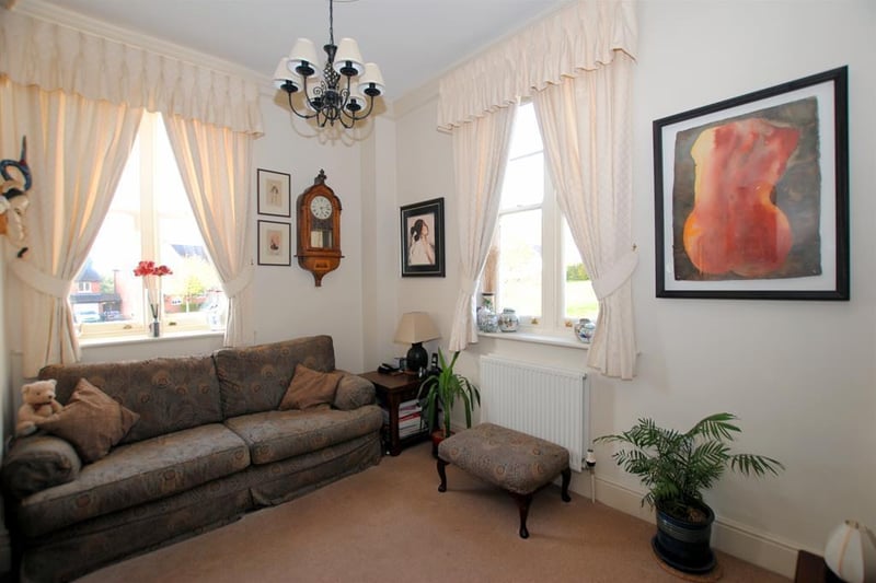 The dual-aspect sitting room on the first-floor enjoys open-plan access to the larger lounge.