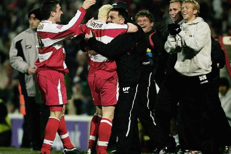 Dave Penny celebrates with goal-scorer Sean Thornton during the Carling Cup match between Doncaster Rovers and Aston Villa at Belle Vue Stadium on November 29, 2005.