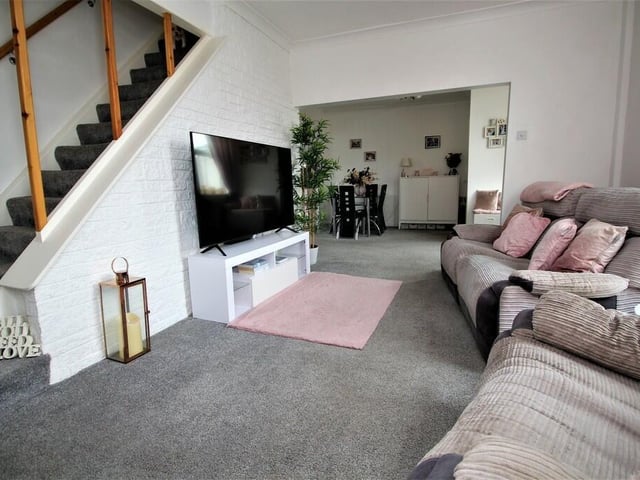 View of the lounge with the dining room to the rear.