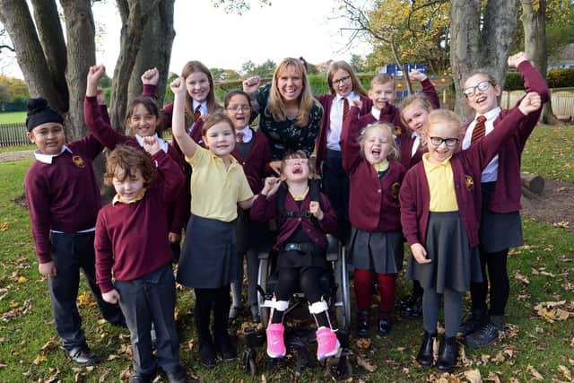 Headteacher Philippa Cousins pictured with pupils celebrating the schools Ofsted result. Picture: NDFP-09-11-21-StMichaelsOfsted 1-NMSY