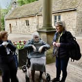 Some of the group have a chat outside the hall