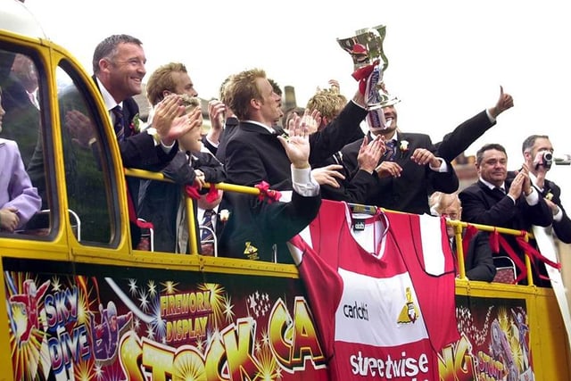 The team let the fans get a look at the cup as the open top bus makes its way around Doncaster, May 18 2003