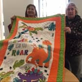 Members of Thorne Quilters donating 12 quilts to Project Linus Doncaster branch.