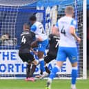 Barrow's Tyrell Warren scores the opening goal.