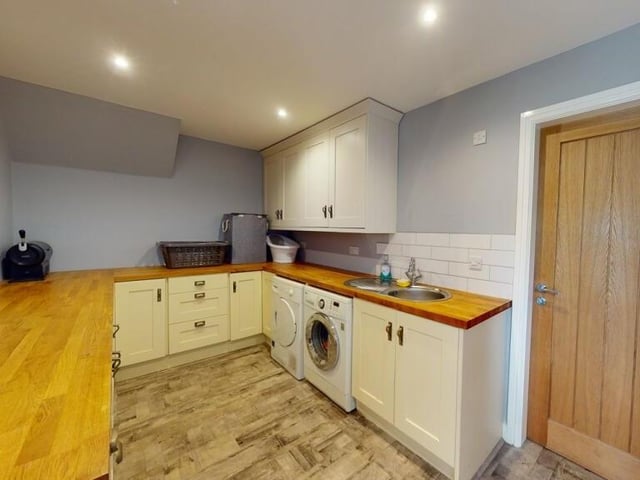 The sizeable utility room.