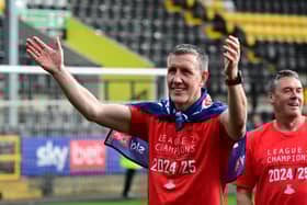 Cliff Byrne and Dave Rennie celebrating the title win at Notts County on the final day.