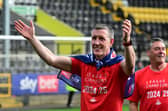 Cliff Byrne and Dave Rennie celebrating the title win at Notts County on the final day.