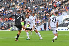 Doncaster Rovers' Luke Molyneux pulls a goal back against Milton Keynes Dons.