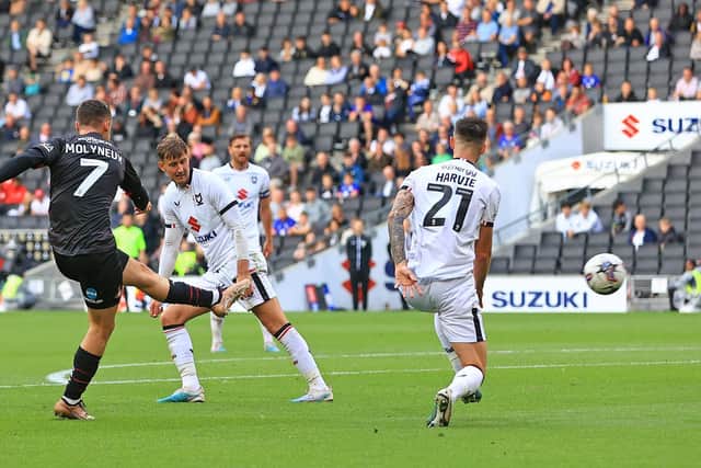Doncaster Rovers' Luke Molyneux pulls a goal back against Milton Keynes Dons.