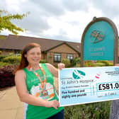 Jo handing over her cheque to Maureen at St John’s