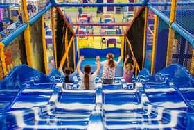 Children enjoy the slide at one of the Play Valley sites