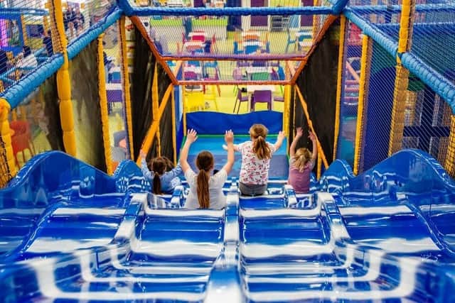 Children enjoy the slide at one of the Play Valley sites