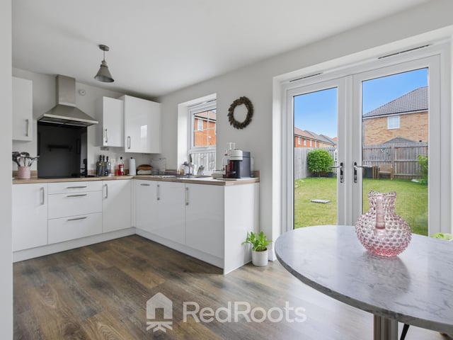 The kitchen with French doors to the garden.