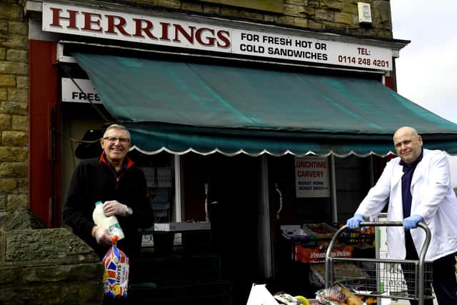 David, left, and Steven Herring  outside their shop in Mosborough getting together one of the food boxes  that have been paid for  from a donation by  Harry Maguire  the former Sheffield United defender.