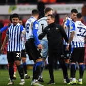 Gary McSheffrey congratulates Sheffield Wednesday's players after their 3-1 win at the Eco-Power Stadium on Saturday.