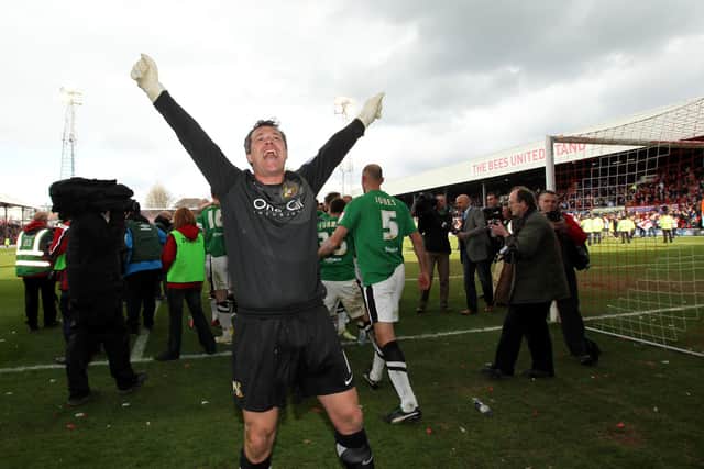 Neil Sullivan celebrates winning the League One title