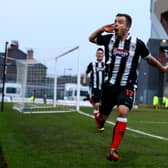 Ross Hannah celebrates scoring against Huddersfield Town in the FA Cup third round during his Grimsby Town days (photo by Matthew Lewis/Getty Images).