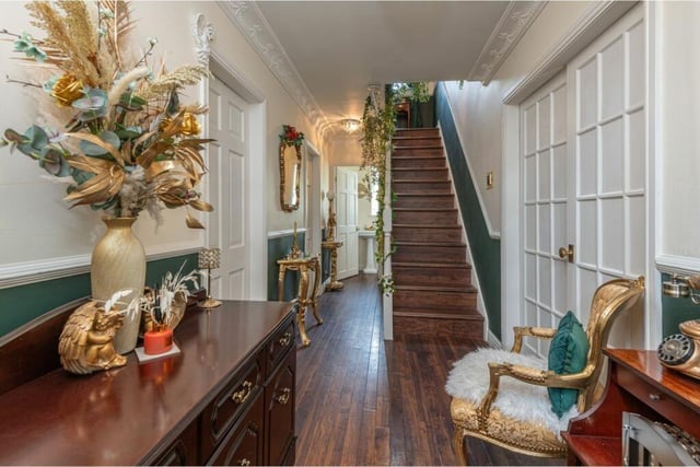 The entrance hallway to the property, with staircase leading up.