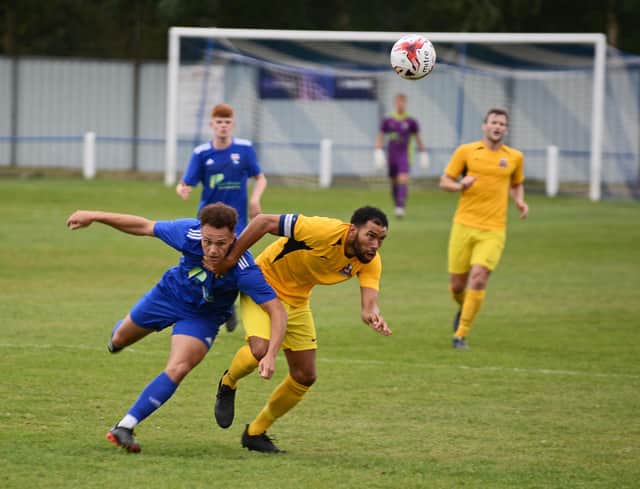 Rossington's hat trick hero Jack Watson battles for the ball. Pictures by Marie Caley