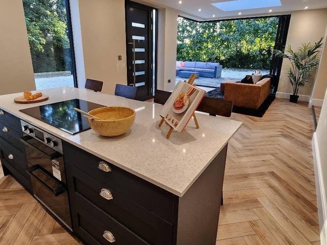 The open plan kitchen arrangement on the ground floor of the High Melton property for sale.