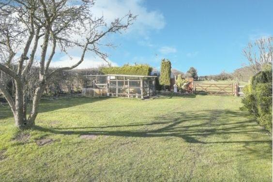 The property stands within a plot of around two acres.