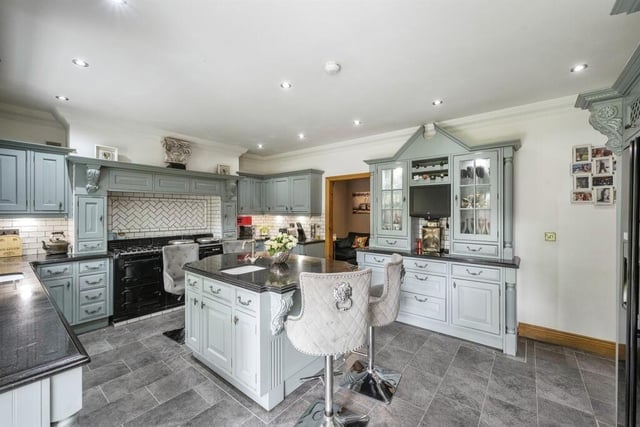 The breakfast kitchen with an aga, bespoke units and granite worktops.