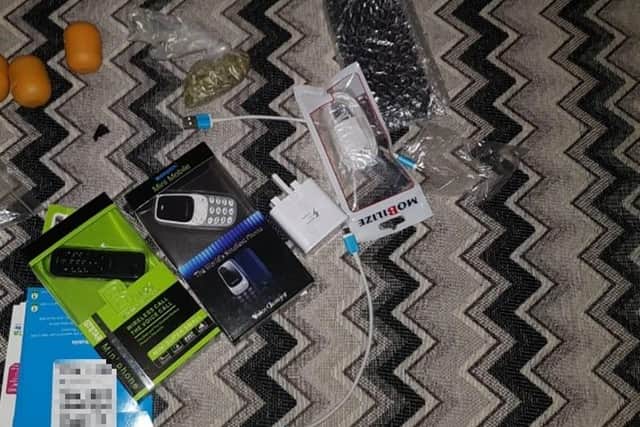 A picture of mobile phones, chargers and Kinder Egg holders were found on Sked's phone