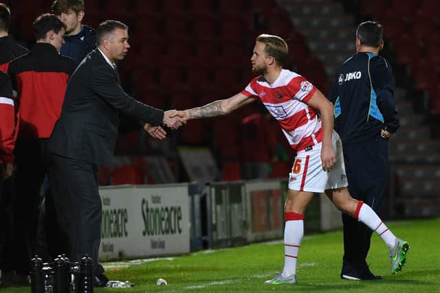 James Coppinger shakes hands with Darren Ferguson