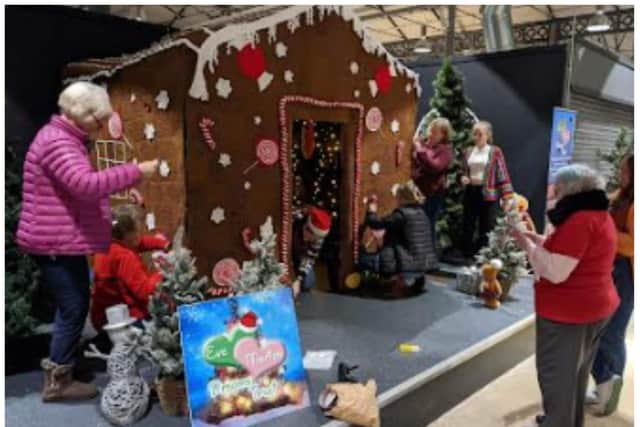 The giant gingerbread house is assembled at Doncaster Wool Market.