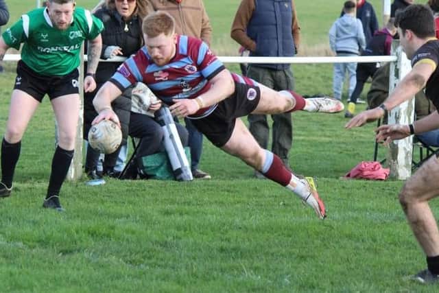 Luke Cade dives over for Toll Bar.