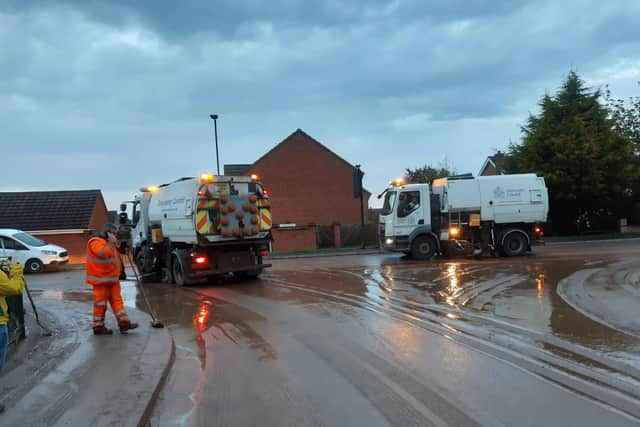 Council workers clearing up after the flash flooding in Adwick