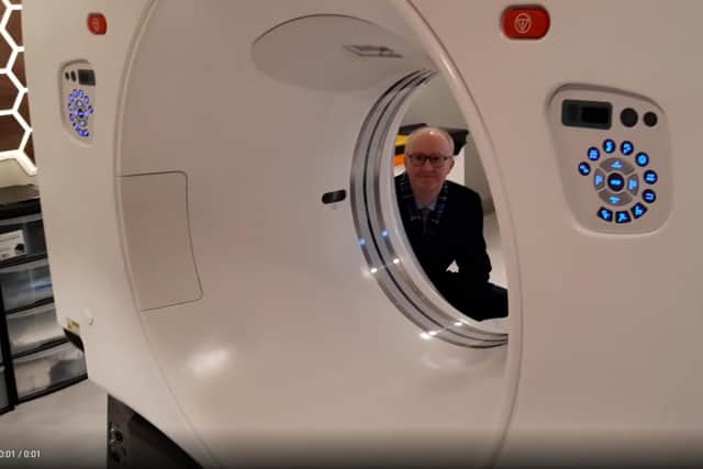 Dr Jason Page with the scanner