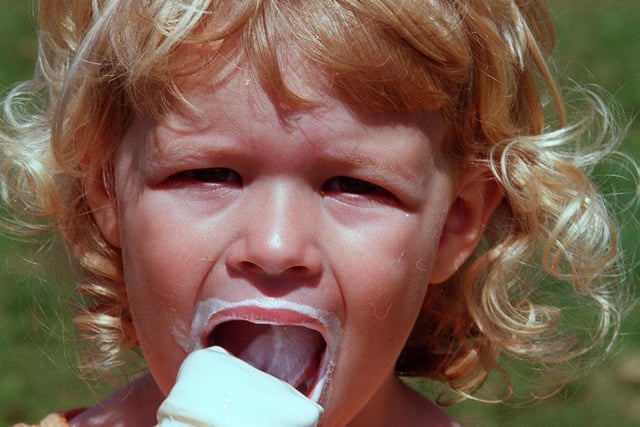 Pictured on the Norton Showground in 1998 where the Norton show was held. Seen is Emma Broadbent age two from Brinsworth enjoying an ice cream