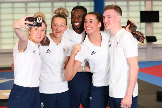 Bradly Sinden, right, is pictured with GB Taekwondo teammates Jade Jones, Lauren Williams, Mahama Cho and Bianca Walkden ahead of the Tokyo 2020 Olympic Games. Photo by Alex Livesey/Getty Images for British Olympic Association