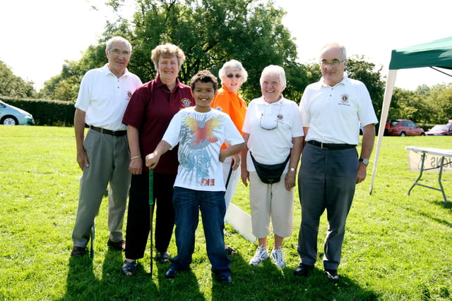 Linus Fossu, 11, stands with some of the Lions after having a go on the golf stall at the fun day for people with disabilities held at Sandall Park in 2009